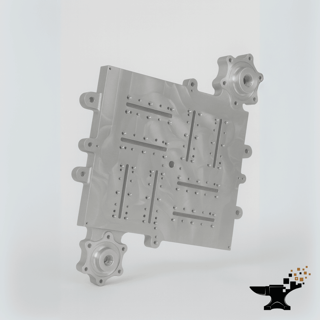 A silver, machined metal part with several holes, grooves and two protruding round flanges, shown on a light background with a black anvil logo in the bottom right corner.