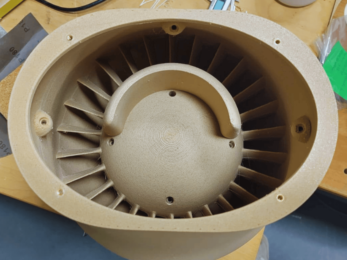 Pre-chamber with interior view. Turbine design for holding the inner ball.