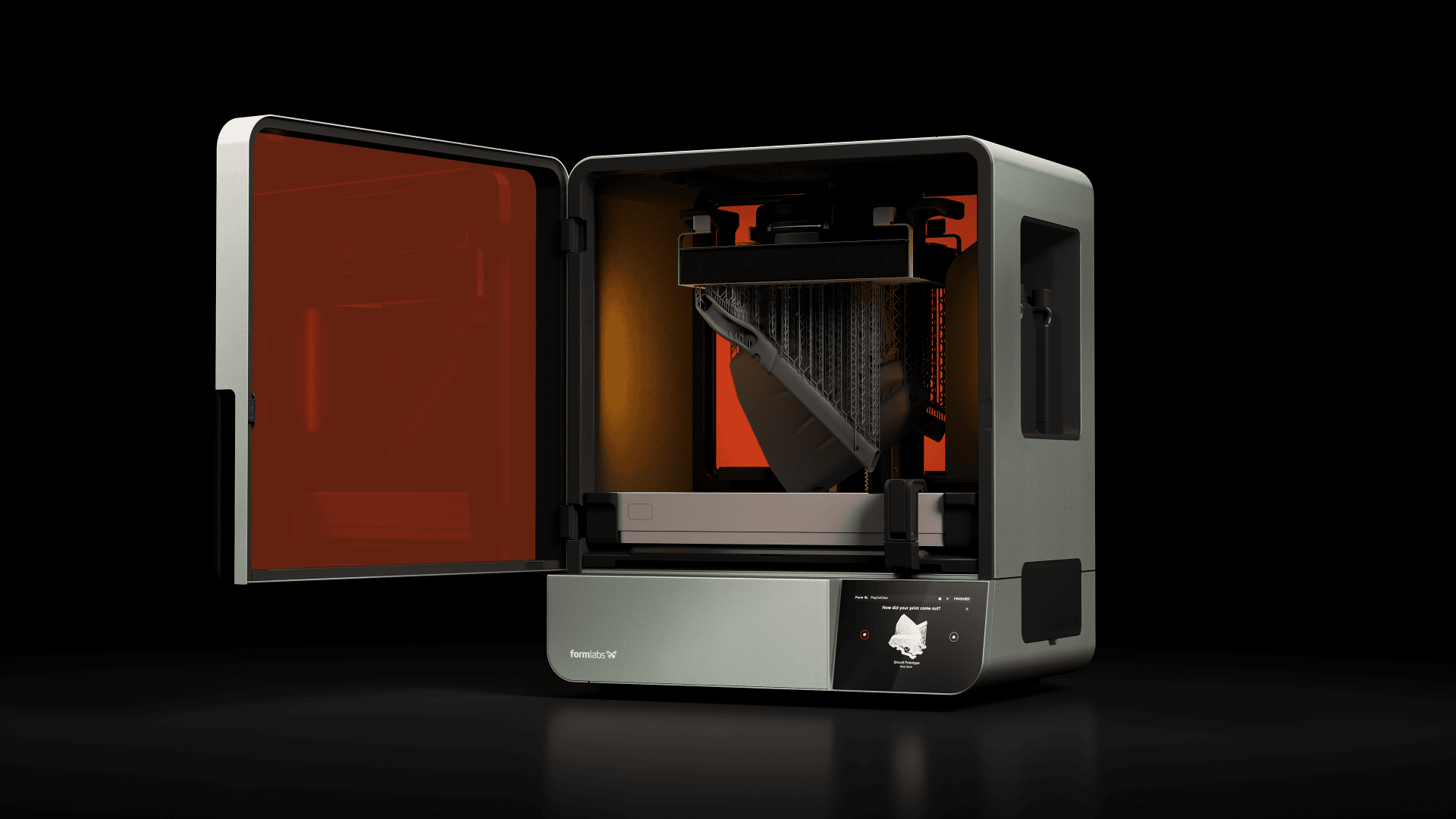 A 3D printer with a partially open orange door prints a detailed black object. The device has a modern design with a touchscreen surface on the front.