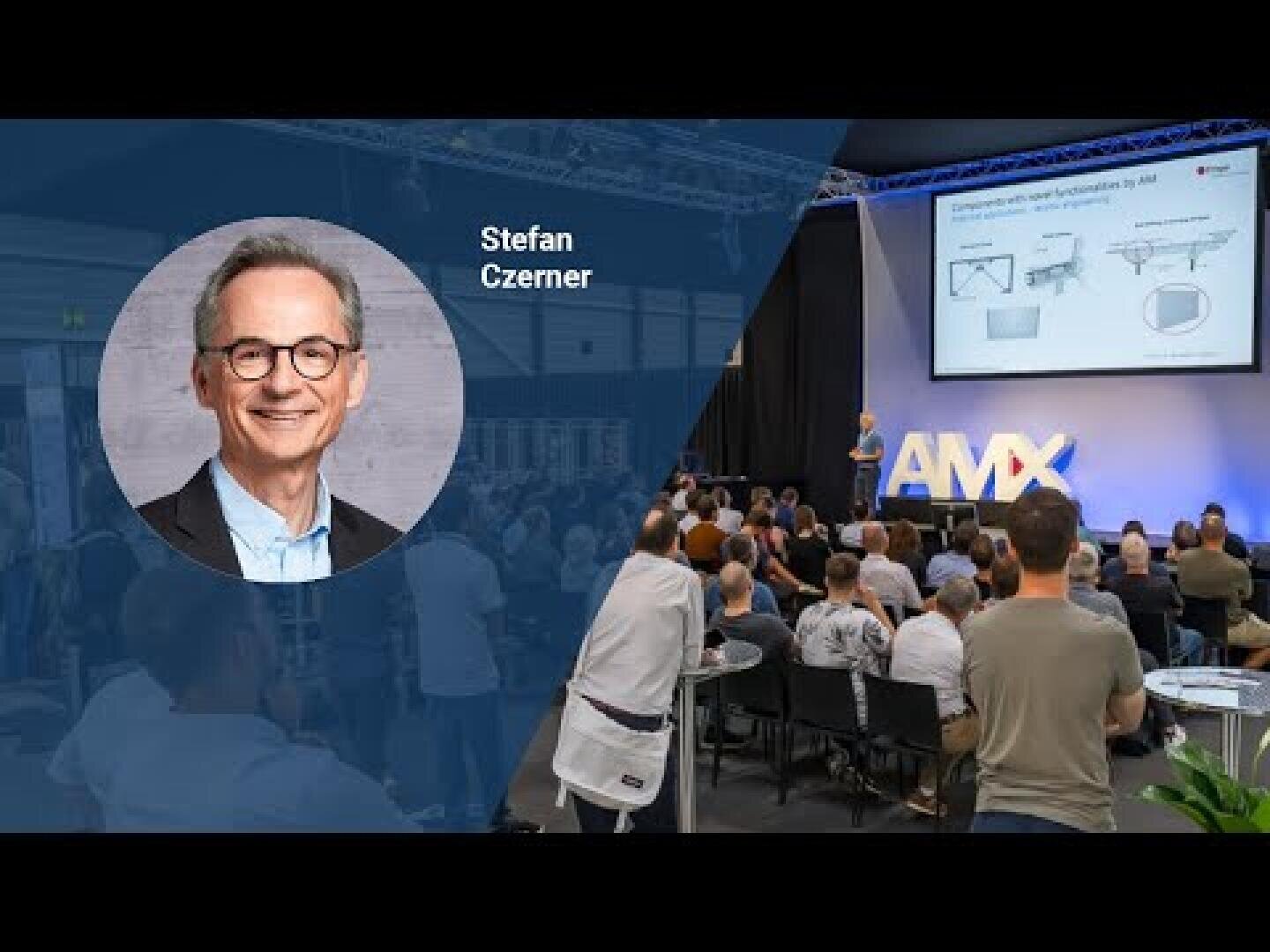 The left-hand side shows a man called Stefan Czerner with a portrait and his name. On the right-hand side, he is speaking on a stage to an audience at an event, with a screen showing a presentation and AMX on stage.