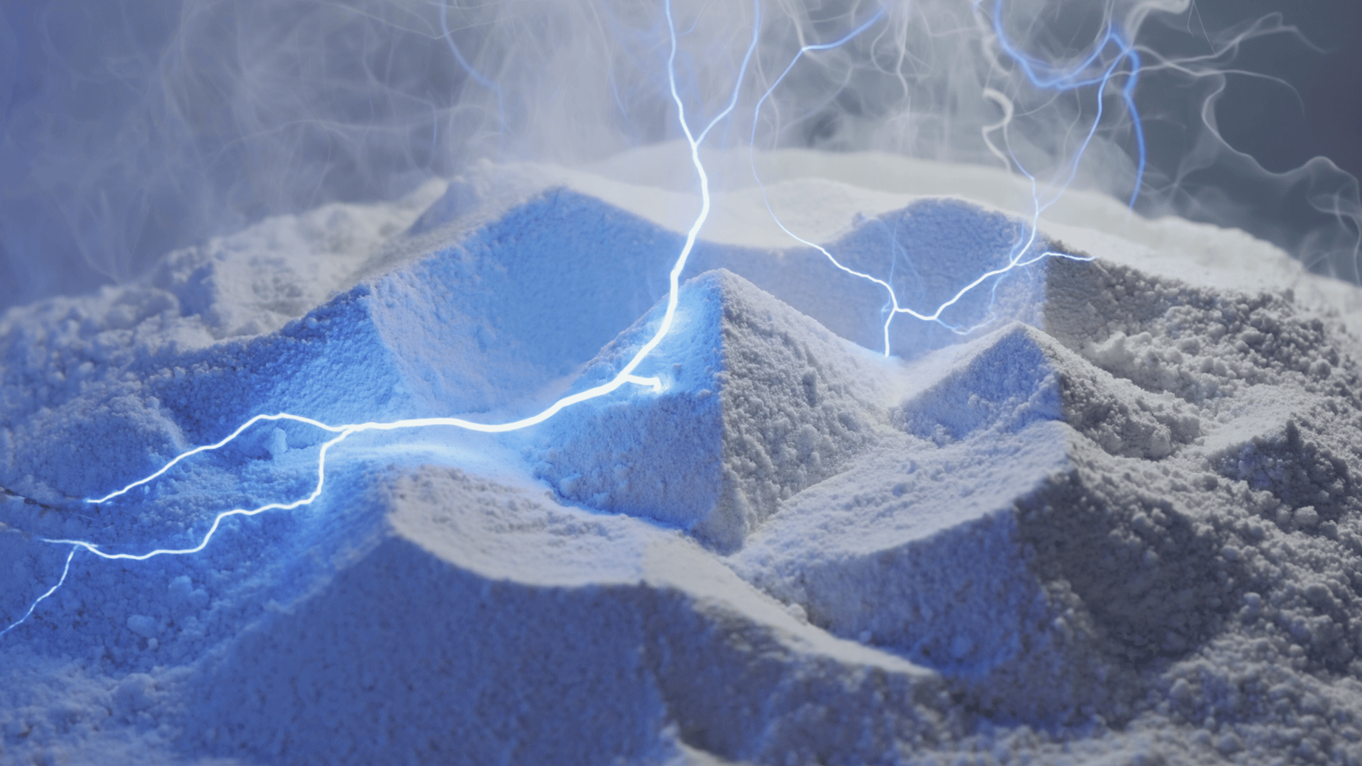 A close-up view of white powdery mounds with blue electrical lightning arcs and mist hovering above them, creating a dramatic and futuristic atmosphere.
