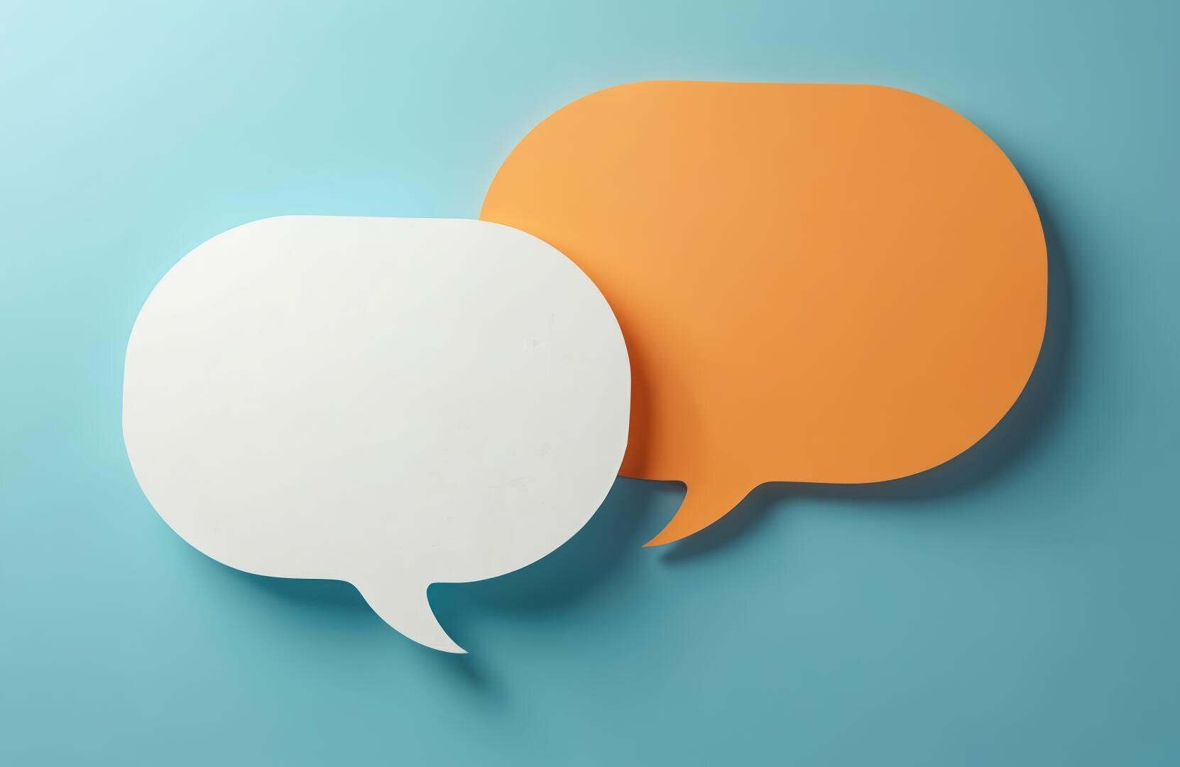 Two overlapping speech bubbles, one white and one orange, on a light blue background symbolize a conversation or communication.